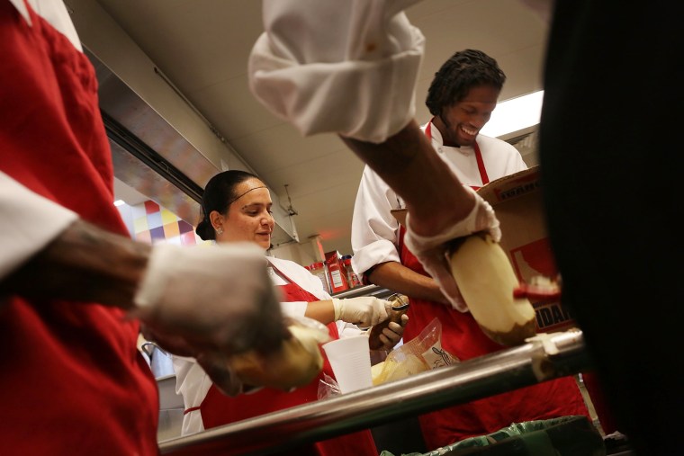 Workers in a culinary arts training program prepare meals at the Cathedral Kitchen soup kitchen that serves 300 to 600 meals a day, six days a week, to the needy and hungry in Camden, N.J., Oct. 11. Cathedral Kitchen was founded in 1976 and offers a variety of programs and life services to Camden's poor and disadvantaged.