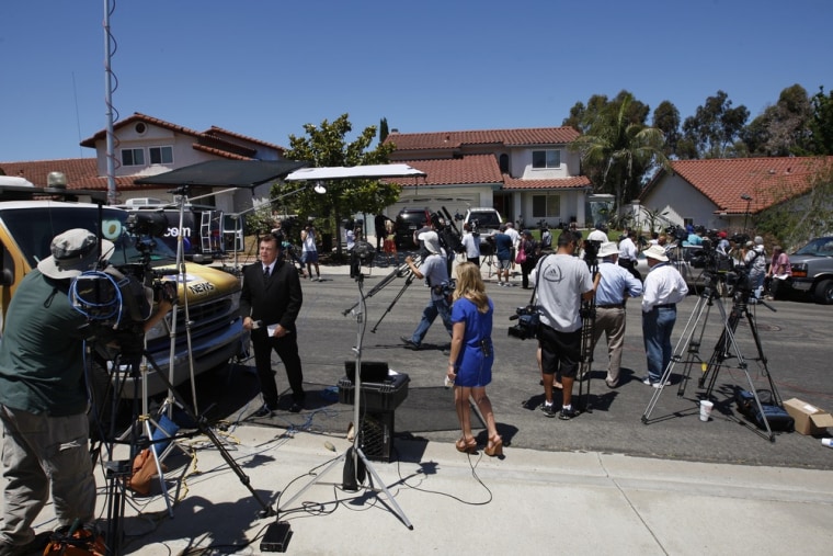 Television news crews gather in front of the home of Robert and Arlene Holmes, parents of James Eagan Holmes, 24, who is accused of killing 12 and injuring 58 people in a Colorado movie theater shooting.