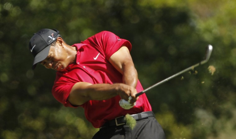 Tiger Woods hits his tee shot on the third hole during final round play in the 2010 Masters golf tournament at the Augusta National Golf Club in Augusta, Ga., on April 11, 2010.