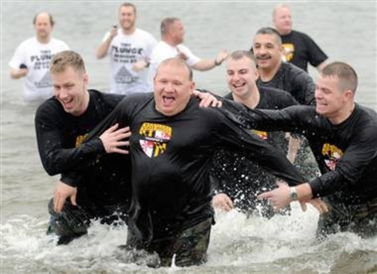 Members of the Maryland State Police take a dip in the icy Chesapeake Bay on Jan. 30, 2010 to raise money for the Special Olympics.