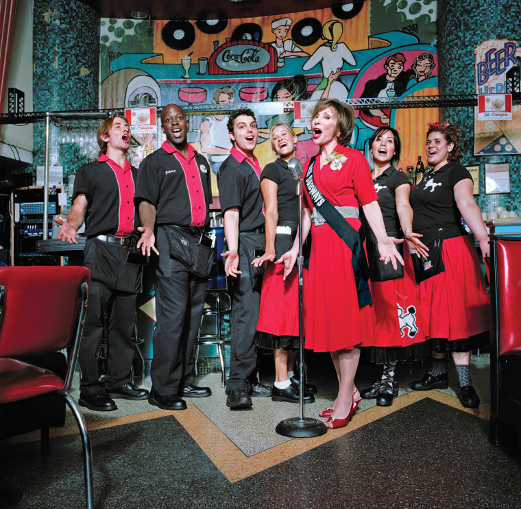 Ellen Hart Sturm, third from right, sings at her restaurant, Ellen's Stardust Diner, on Broadway in New York in 2007. Sturm appeared on placards in the New York City subways during March and April of 1959 in the