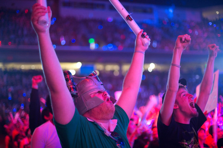 Kyle Baker and Michael Pickle cheer during the League of Legends event on Saturday, Oct. 13, 2012, in Los Angeles.