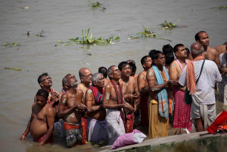Hindu devotees take part in the