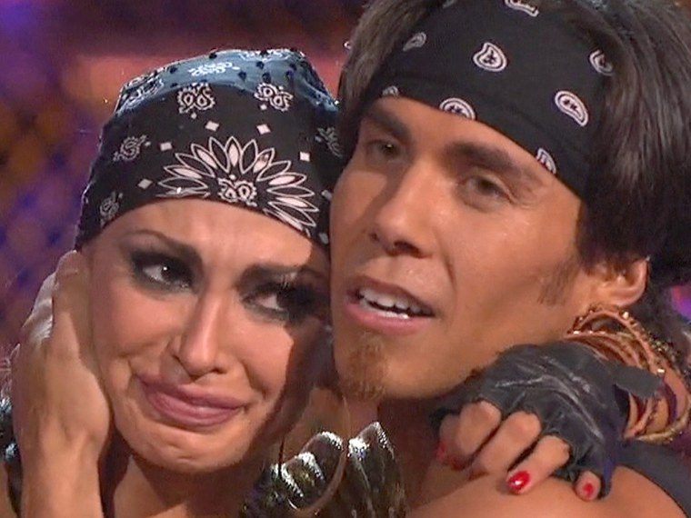 Karina Smirnoff reacts to her fall as she awaits the judges' comments with partner Apolo Anton Ohno.