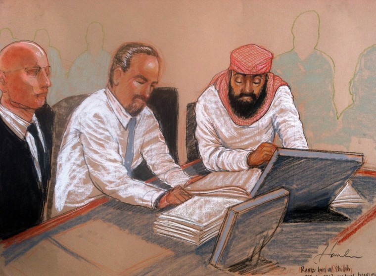 Guantanamo prisoner Ramzi Binalshibh, right, sits with a court translator and his lawyer Navy Lt. Cmdr. Kevin Bogucki, left, during a Military Commissions pretrial hearing for five prisoners accused of the Sept. 11 terrorist attacks, at the U.S. Naval Base in Guantanamo Bay, Cuba, on Tuesday.
