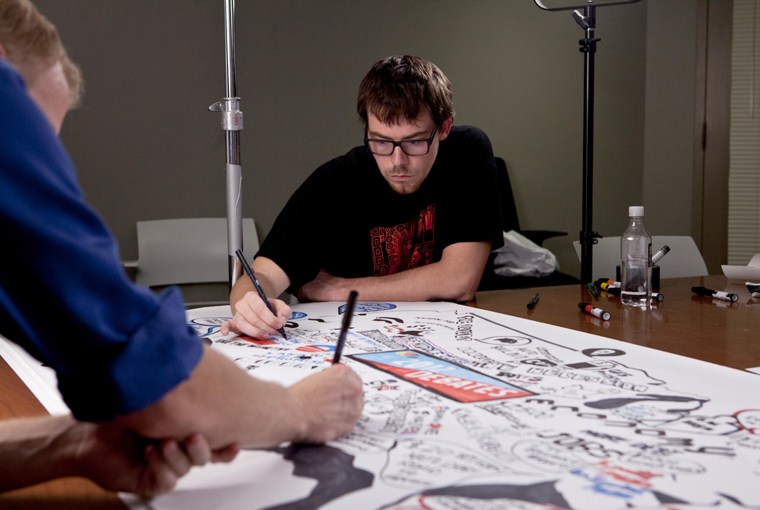 The artists are part of a group called Whiteboard Animation Studio in Brooklyn, New York.