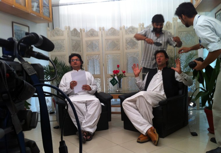 Imran Khan, seated at right, prepares to take part in his - and Pakistan's - first ever Google Hangout.