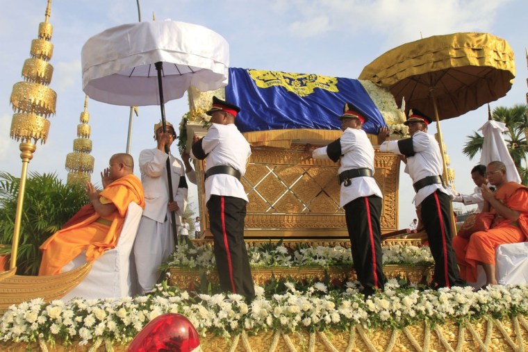 The casket containing the body of King Norodom Sihanouk is carried on a float shaped like a phoenix in the procession through Phnom Penh.