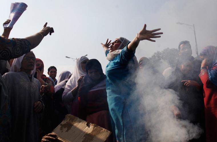 Kashmiri Muslim women shout anti-government slogans after they burn an effigy of Jammu and Kashmir state Chief Minister Omar Abdullah during a protest in Srinagar, India, on Oct. 17.
