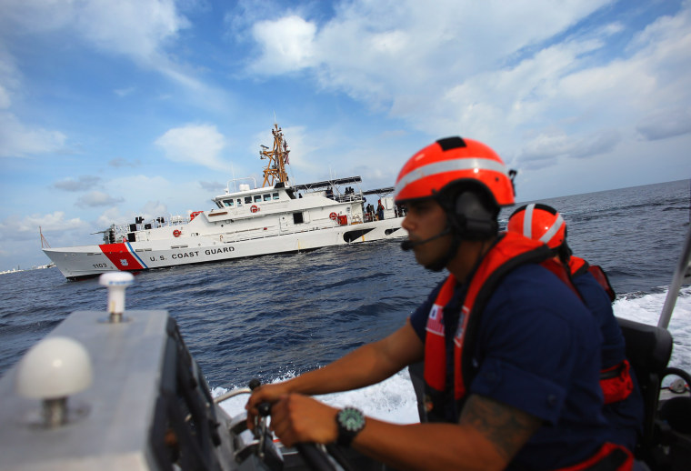 United States Coast Guard BM1 Christopher Valdes drives the 7.9-meter small boat alongside the United States Coast Guard Cutter William Flores on Oct.17 just off the shore of Miami Beach, Fla.