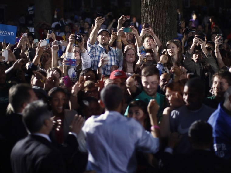 Supporters of U.S. President Barack Obama take photographs with their cameras during his campaign rally at Ohio University in Athens, Ohio, October 17, 2012.