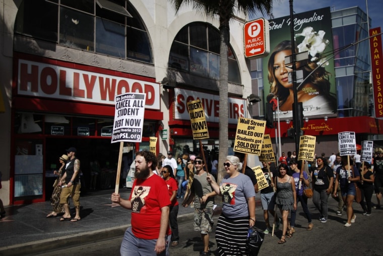 Students march on Hollywood Boulevard while protesting the rising costs of student loans for higher education on September 22, 2012. The average college student who graduated in 2011 had $26,600 in student loans, according to a new report, which estimates two-thirds of last year's college graduates had student loan debt.