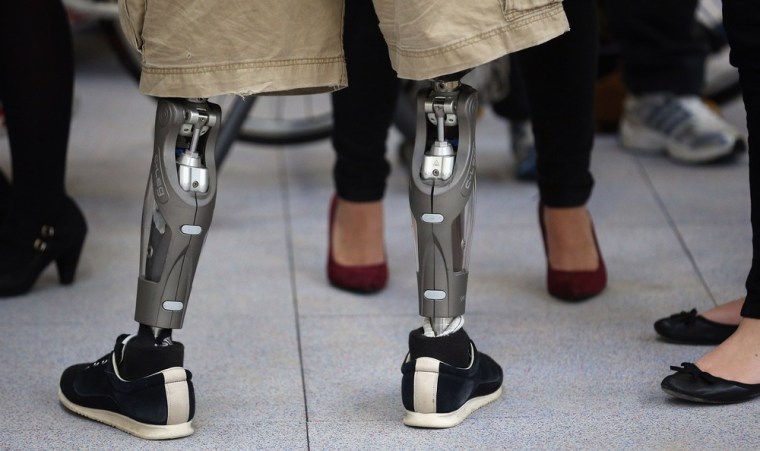 A wounded serviceman stands on prosthetic legs as he talks to visiting media in the new Help for Heroes' Tedworth House rehabilitation center for wounded servicemen and women during a press preview day on Oct. 18 in Tidworth, England.