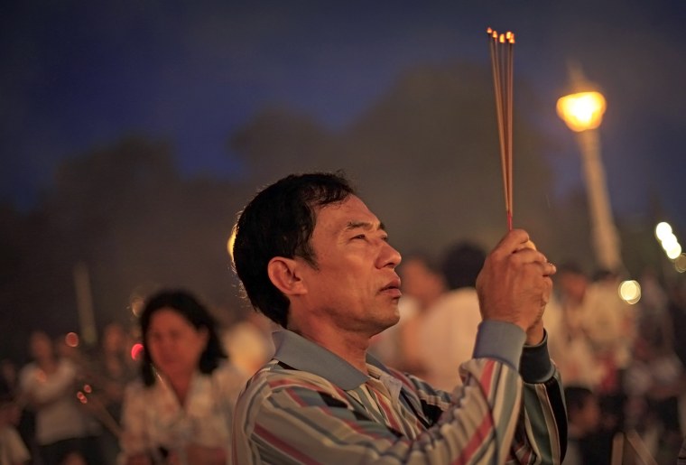 A man mourns former king Norodom Sihanouk at the Royal Palace.
