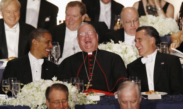Obama and Romney share a laugh with Cardinal Timothy Dolan, center.
