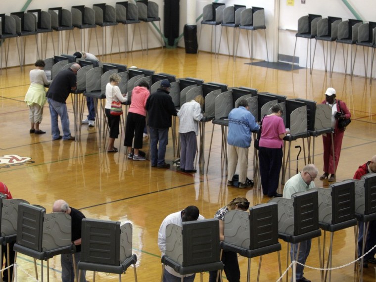 Voters cast their ballots at the Herbert Young Community Center polling place in Cary, N.C., on Thursday, Oct. 18, 2012, the first day of early voting in North Carolina.