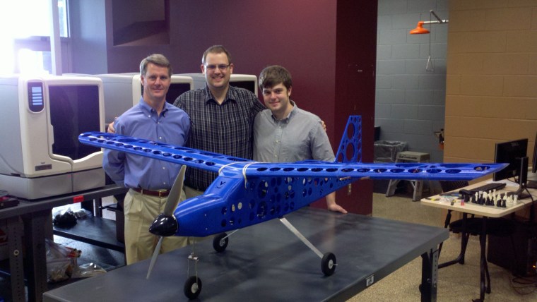 University of Virginia engineer David Sheffler and students Steven Easter and Jonathan Turman pose with their 3-D printed plane