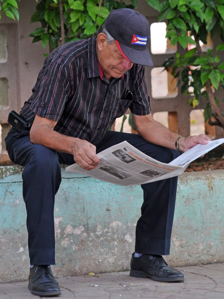 A man in Havana on Oct. 22 reads the edition of Granma that features recent pics of Fidel Castro.