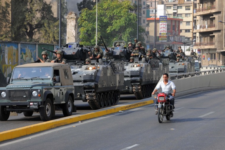 Lebanese Army soldiers patrol a neighborhood after overnight clashes between Sunni and Shiite gunmen in Beirut, Oct. 22, 2012.