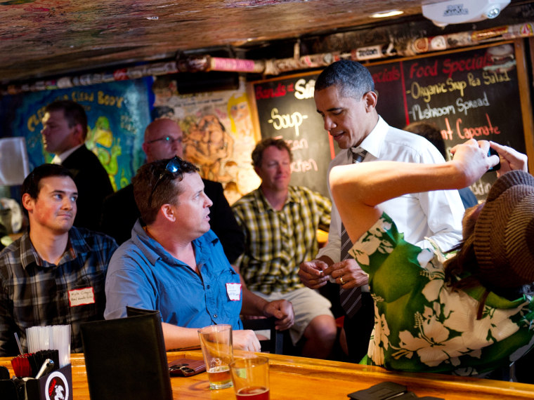 President Barack Obama greets patrons at The Sink Restaurant and Bar April 24, 2012 in Boulder, Colo.