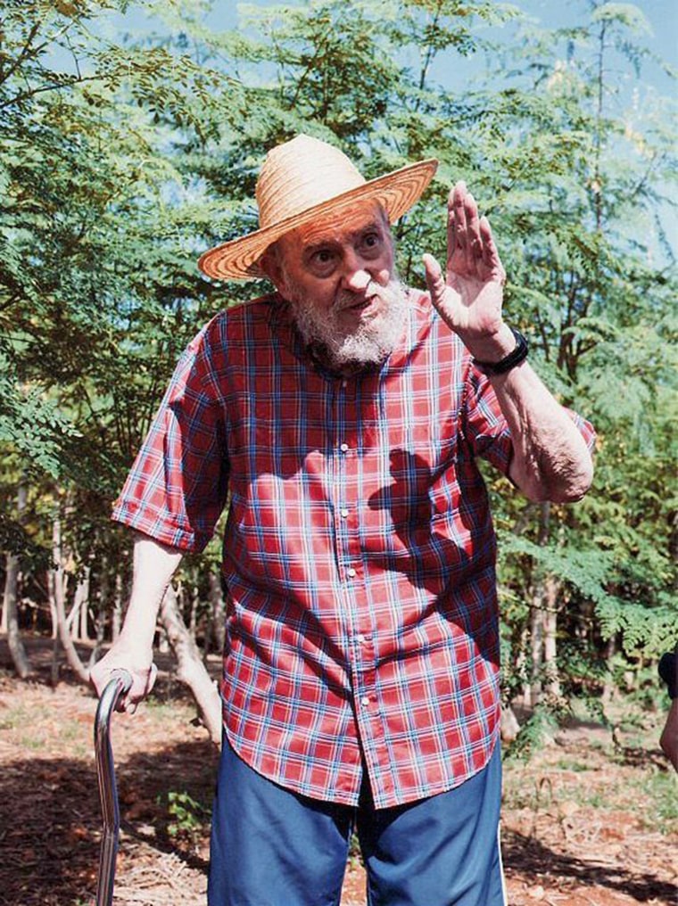 A handout picture provided by Cubadebate on Oct. 22, 2012, shows former Cuban President Fidel Castro walking in a garden on Oct. 19.