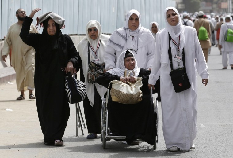 Muslim pilgrims leave the Grand mosque after the noon prayer in Mecca, Saudi Arabia, on Oct. 22, 2012.
