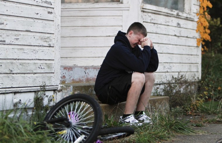 A teen who declined to be identified is overcome with grief after visiting the crime scene on Clayton Avenue in Clayton, N.J. on Oct. 23.
