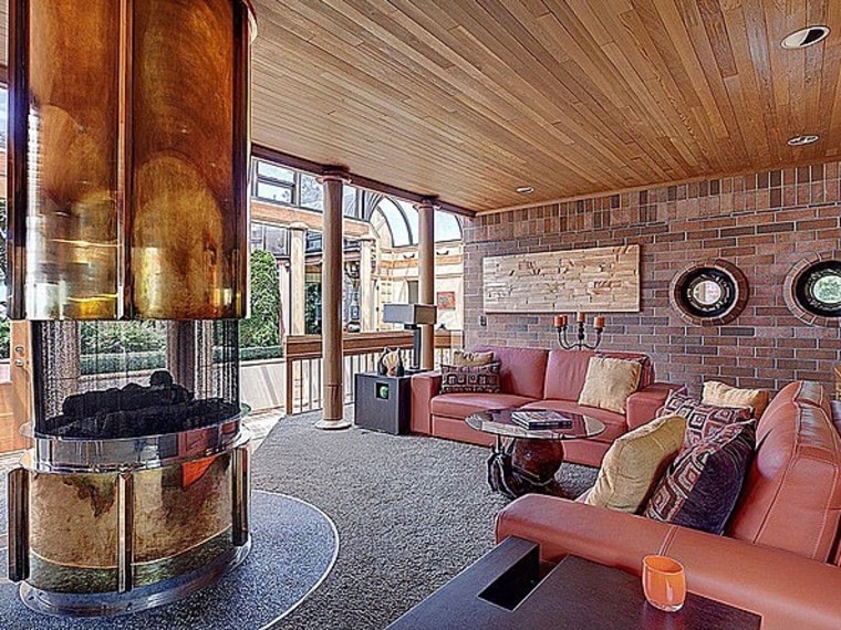 The home is defined by a round fireplace in the living room.
