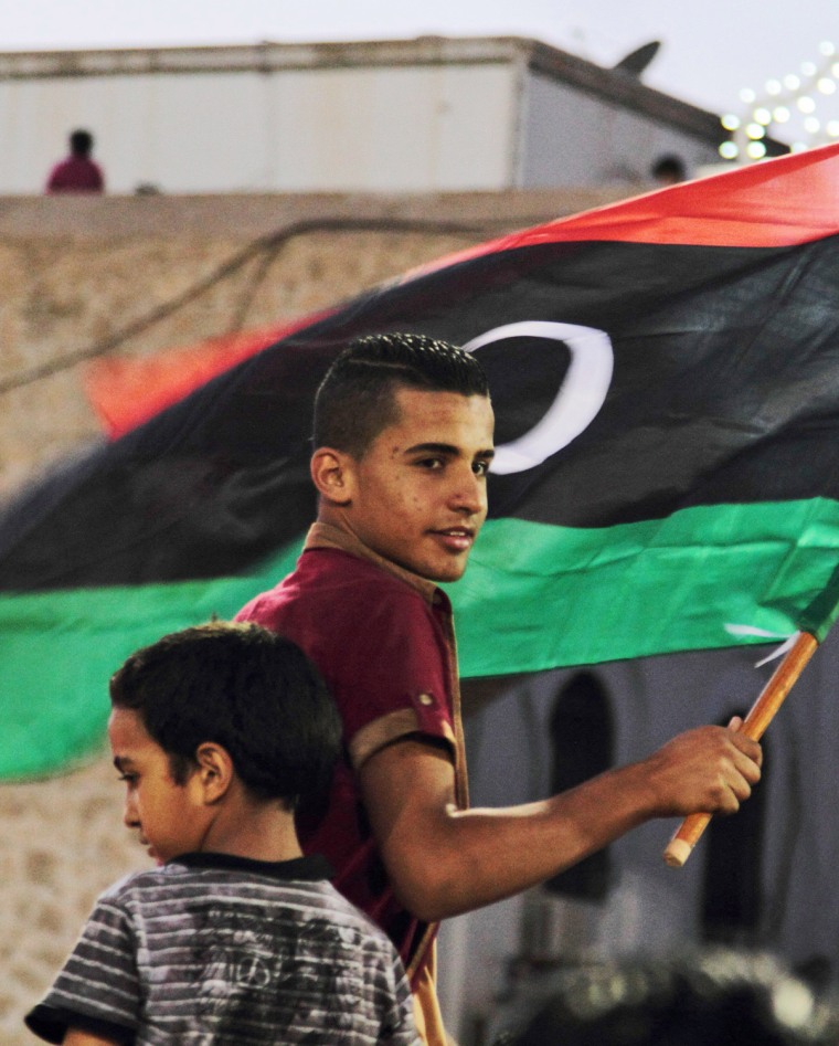 Libyans celebrate one year since the country declared liberation from former dictator Muammar Gaddafi, at Martyrs Square in Tripoli, Libya, Oct. 23.