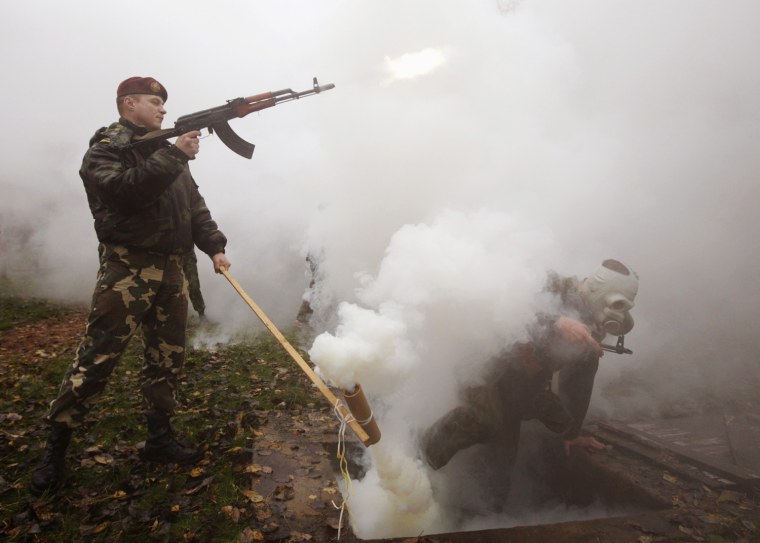 Servicemen from the Interior Ministry special unit take part in a test near the village of Gorany, Belarus, Oct. 23, 2012.