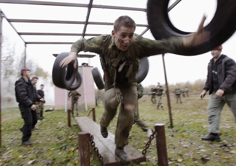 Servicemen from the Interior Ministry special unit take part in a test near the village of Gorany, Belarus, Oct. 23.