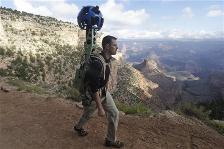 Google product manager Ryan Falor walks with the Trekker during a demonstration.
