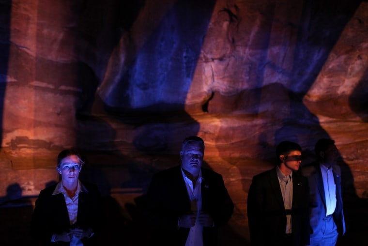 Secret Service agents look on during a campaign rally for Republican presidential candidate Mitt Romney at the Red Rocks Amphitheatre on October 23, 2012 in Morrison, Colorado.