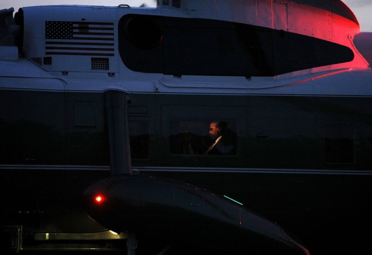 President Barack Obama sits aboard Marine One as it lands on the South Lawn of the White House on October 23, 2012 in Washington, DC. Obama was returning from campaign events in Florida and Ohio.