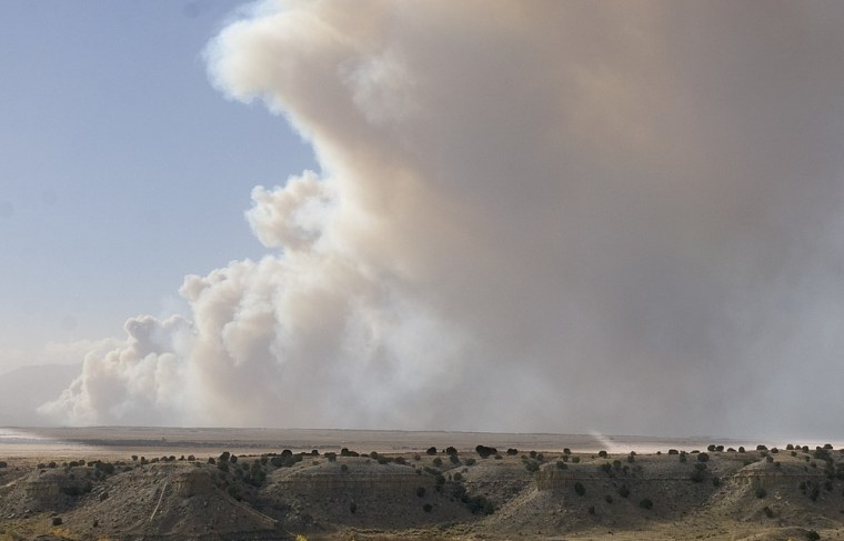 Smoke billows from a wildfire near Wetmore, Colo., on Tuesday.