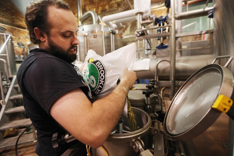 New York: Production manager Jimmy Valm adds hops to the boil in the brewhouse at Brooklyn Brewery.