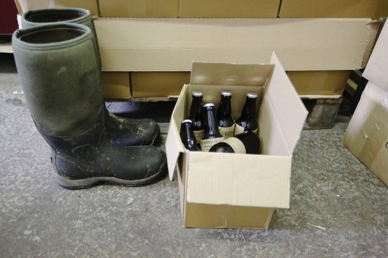 London: A box of beer and a pair of wellington boots are seen at The Kernel micro-brewery.