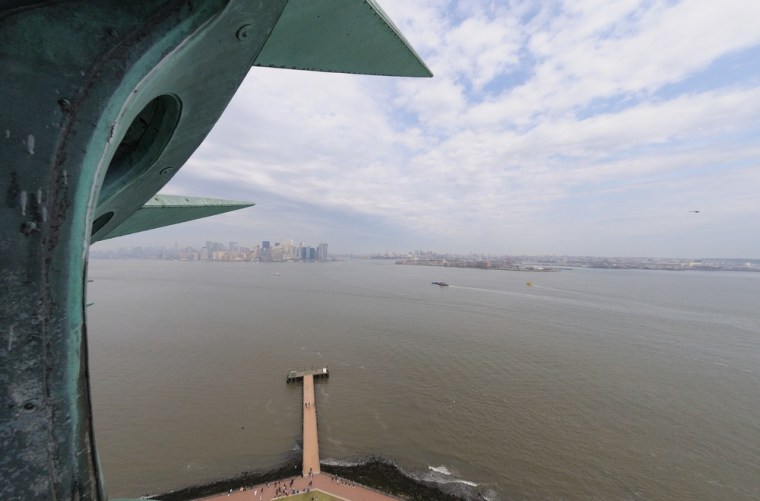 Visitors to the crown of the Statue of Liberty get a great look at New York Harbor.