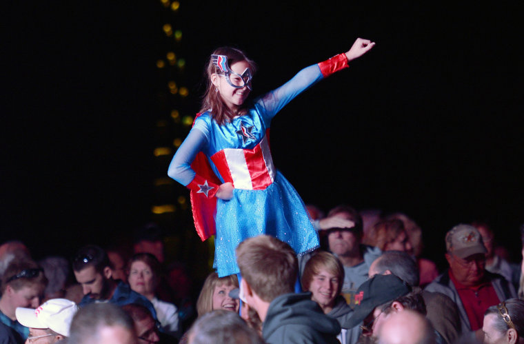 A young supporter of presidential candidate Mitt Romney is dressed as