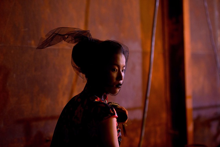 A Model waits backstage prior to the SEC Qi Gang fashion show during China Fashion Week in Beijing on Oct. 26.