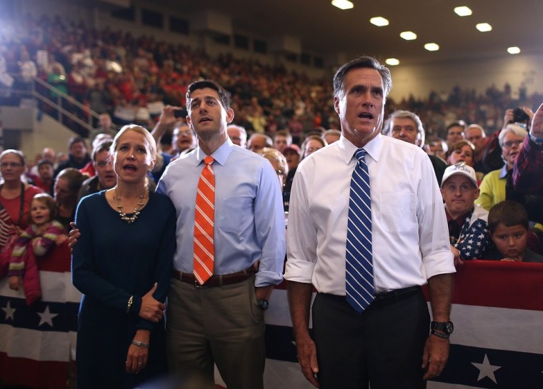 Mitt Romney and Paul Ryan sing along with Janna Ryan as the Oakridge Boys perform during a campaign rally at the Marion County Fairgrounds in Marion, Ohio on Sunday.