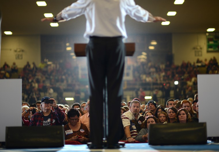 Supporters listen to Republican Presidential candidate Mitt Romney during a rally at the Veterans Memorial Coliseum in Marion, Ohio on October 28, 2012.