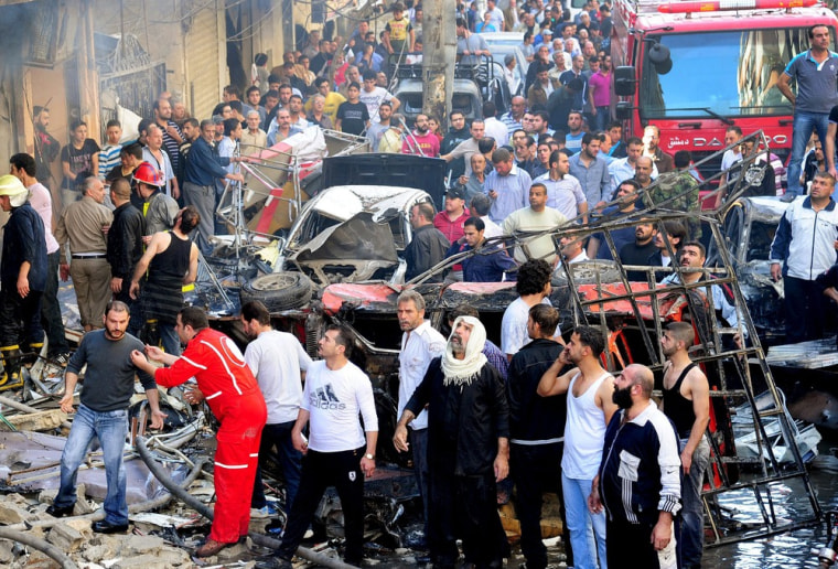 People gathering at the site of the explosion.