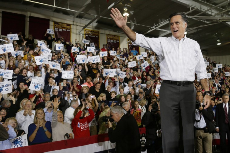 Republican presidential candidate Mitt Romney waves to supporters as he takes the stage at a campaign stop at Avon Lake High School in Avon Lake, Ohio, Oct. 29, 2012.