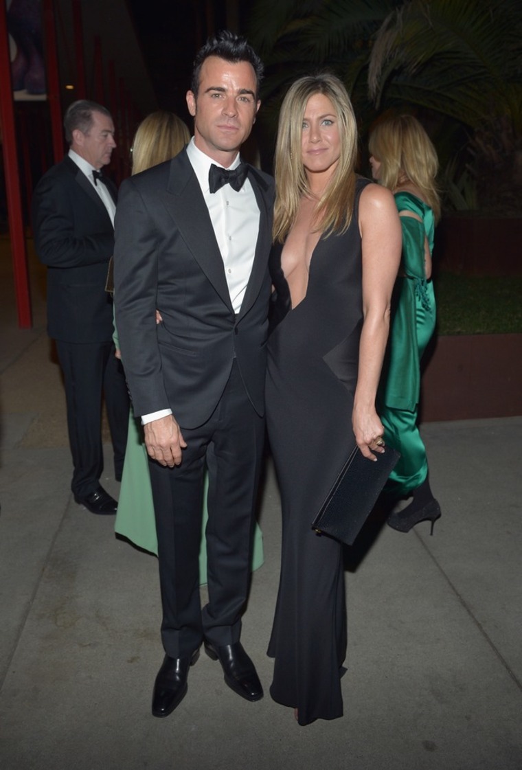 Jennifer Aniston rocks a plunging neckline in sexy black gown