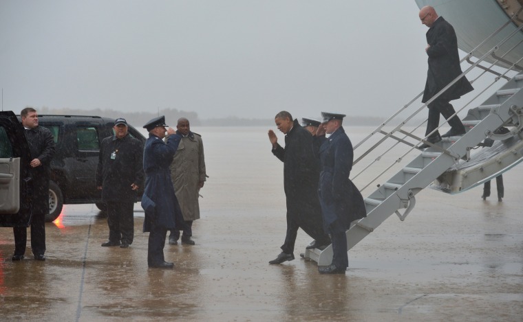 President Barack Obama steps off Air Force One upon arrival at Andrews Air Force Base in Maryland on Monday. Obama cancelled his appearance at a campaign rally in Orlando, Florida and returned early to Washington, DC to monitor response to Hurricane Sandy.