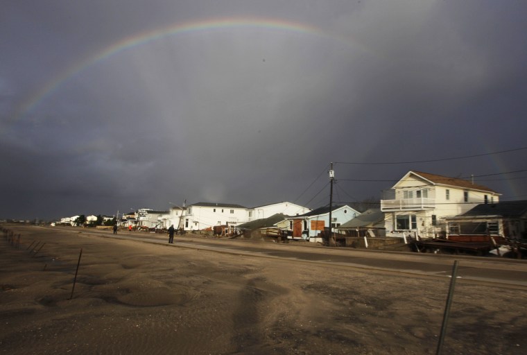 A rainbow forms over Breezy Point in the New York City borough of Queens in the aftermath of superstorm Sandy on Tuesday morning.