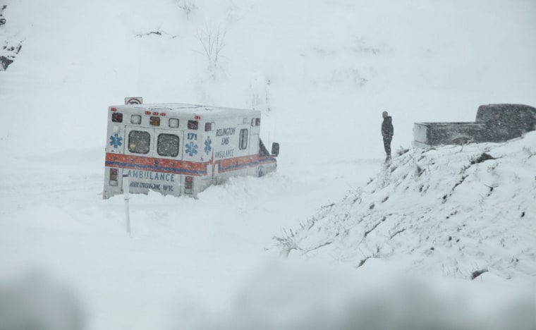 An ambulance is stuck in over a foot of snow off of Highway 33 West, near Belington, W.Va. on Oct. 30.