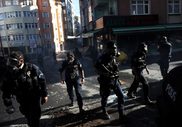 Turkish riot police take positions as they clash with Kurdish demonstrators during a protest in support of a hunger strike movement by Kurdish prisoners in Istanbul, Turkey, Oct. 30.