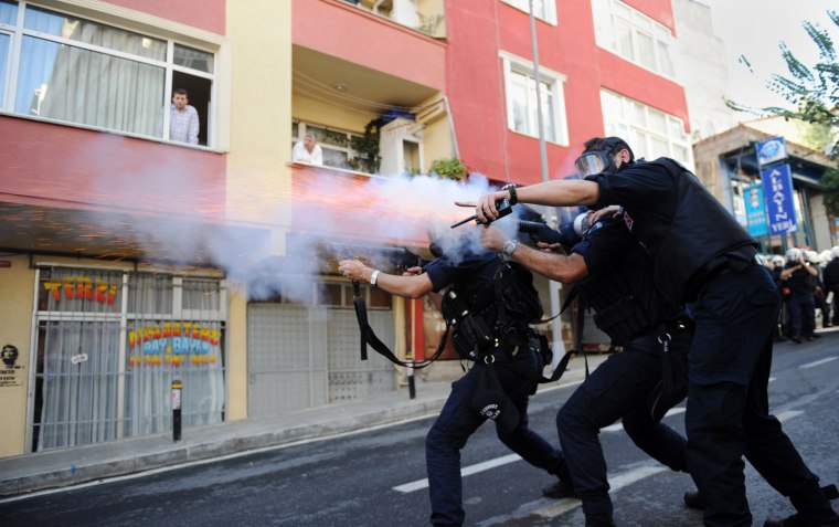 Turkish riot police fire tear gas as they clash with Kurdish demonstrators during a protest in support of a hunger strike movement by Kurdish prisoners in Istanbul, Turkey, Oct. 30, 2012.